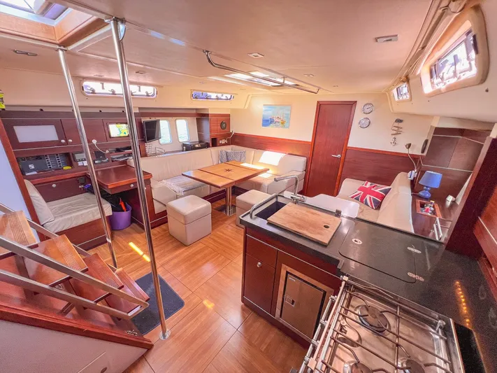  Yacht Photos Pics Luxurious 2010 Hanse 545 yacht interior with modern kitchen and cozy seating area.