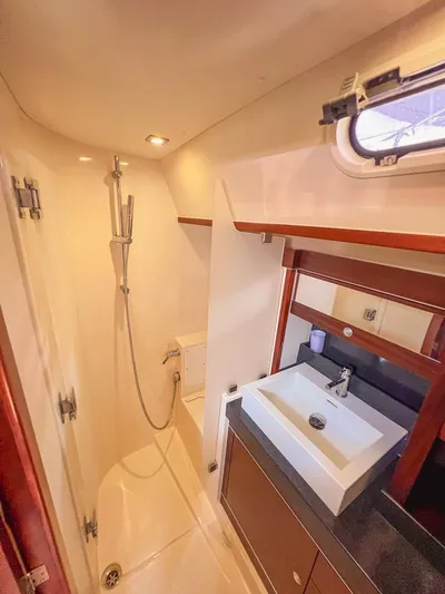  Yacht Photos Pics 2010 Hanse 545 yacht bathroom with modern shower and sleek sink design.