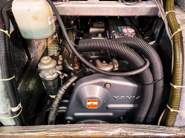  Yacht Photos Pics Engine compartment of a 2010 Hanse 545 yacht, featuring Yanmar components and hoses.