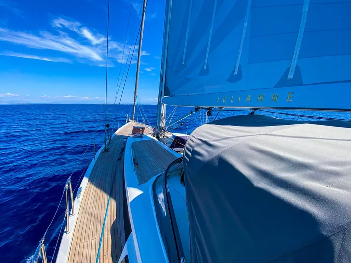  Yacht Photos Pics Sailing on a 2010 Hanse 545 yacht in clear blue ocean waters.