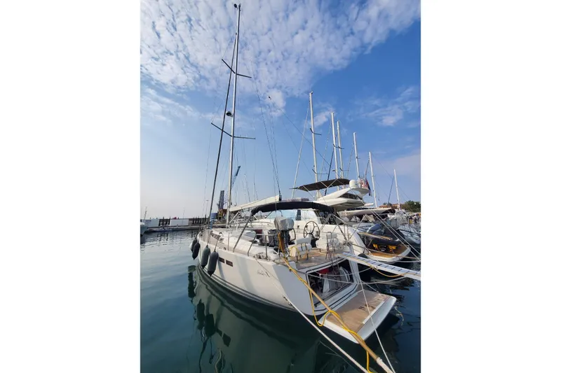  Yacht Photos Pics Sailboat Hanse 545, 2010 model, docked at marina under blue sky.