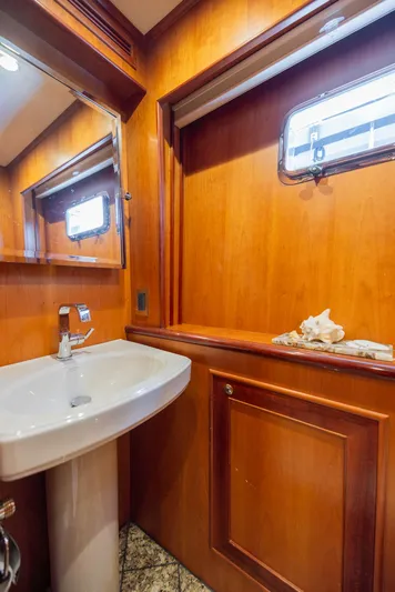 Colette Yacht Photos Pics Luxurious bathroom interior of 2005 Outer Reef Yachts 730 Motoryacht with wooden finish.