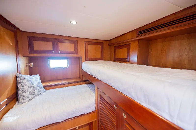 Colette Yacht Photos Pics Bunk beds in 2005 Outer Reef Yachts 730 Motoryacht cabin with wooden interior.