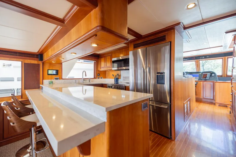 Colette Yacht Photos Pics Luxurious kitchen interior of 2005 Outer Reef Yachts 730 Motoryacht with modern appliances.