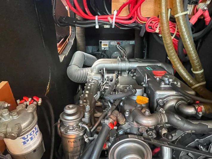  Yacht Photos Pics Engine compartment of a 2006 Beneteau Oceanis Clipper 523 sailboat, showcasing detailed components.