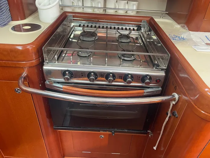  Yacht Photos Pics Stove and oven in 2006 Beneteau Oceanis Clipper 523 yacht kitchen.