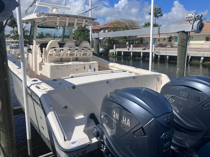  Yacht Photos Pics 2020 Grady-White Canyon 336 boat with Yamaha engines docked by waterfront homes.