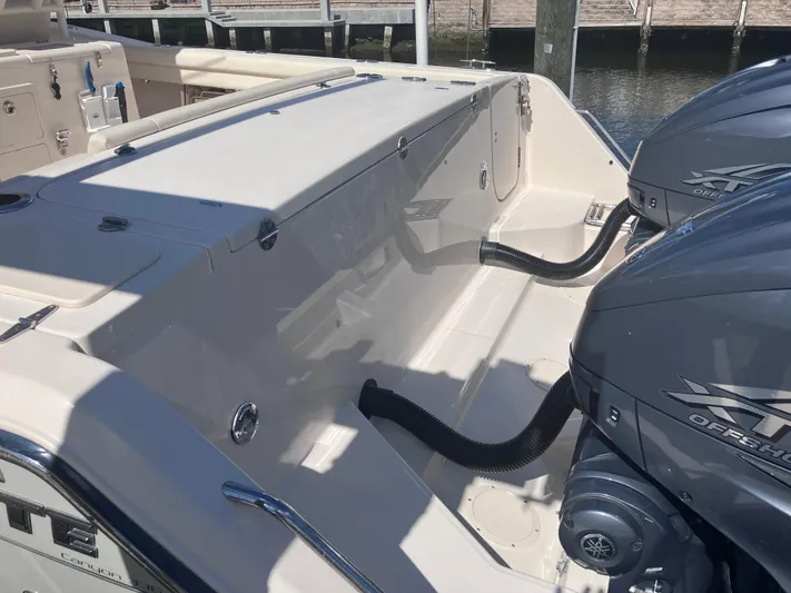  Yacht Photos Pics 2020 Grady-White Canyon 336 boat with dual outboard engines at a dock.