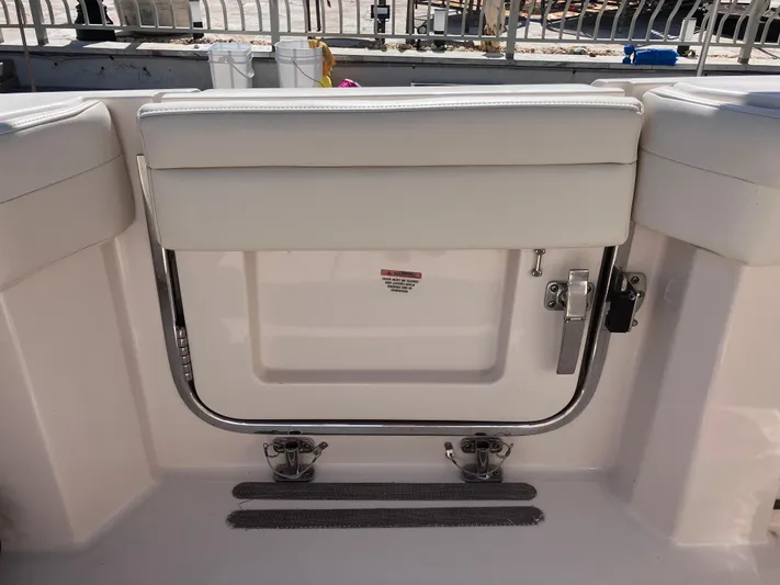  Yacht Photos Pics 2020 Grady-White Canyon 336 boat interior with cushioned seating and stainless steel railing.