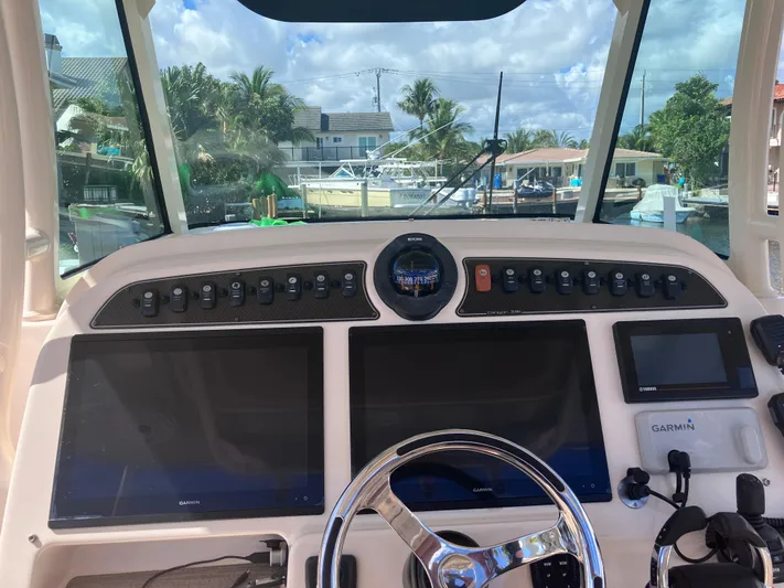 Yacht Photos Pics 2020 Grady-White Canyon 336 helm with dual screens and Garmin navigation system.