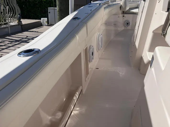  Yacht Photos Pics 2020 Grady-White Canyon 336 boat interior, featuring sleek white deck and seating area.