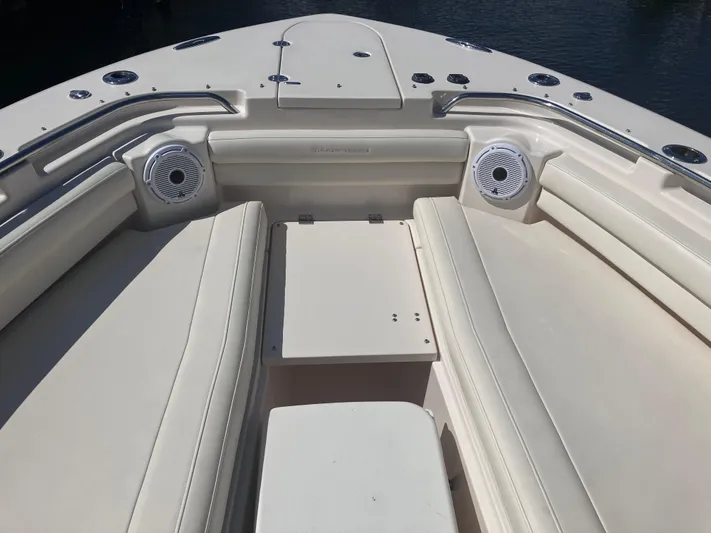  Yacht Photos Pics 2020 Grady-White Canyon 336 boat interior with cushioned seating and speakers.