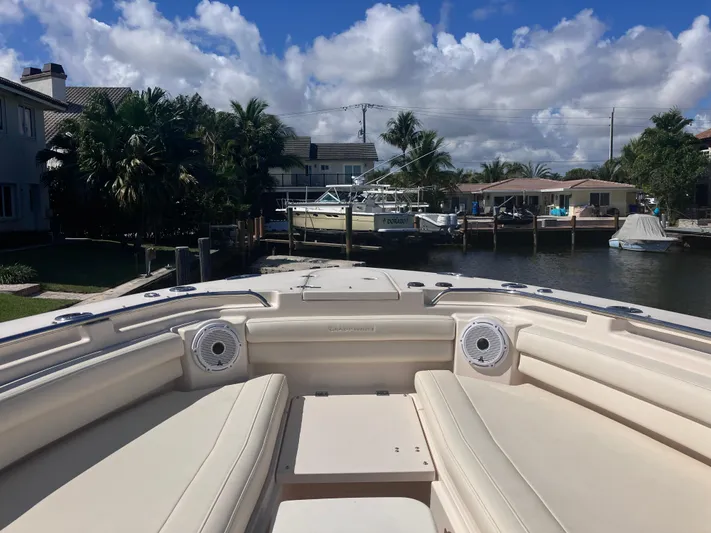  Yacht Photos Pics 2020 Grady-White Canyon 336 boat docked in a scenic waterfront setting.