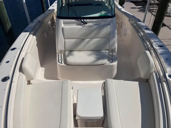  Yacht Photos Pics 2020 Grady-White Canyon 336 boat interior with white seating and console.