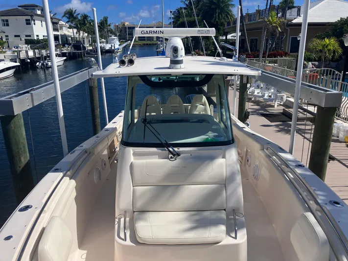  Yacht Photos Pics 2020 Grady-White Canyon 336 boat docked in a marina, featuring a Garmin radar system.