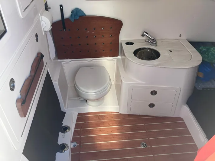  Yacht Photos Pics 2020 Grady-White Canyon 336 boat interior with toilet and sink.