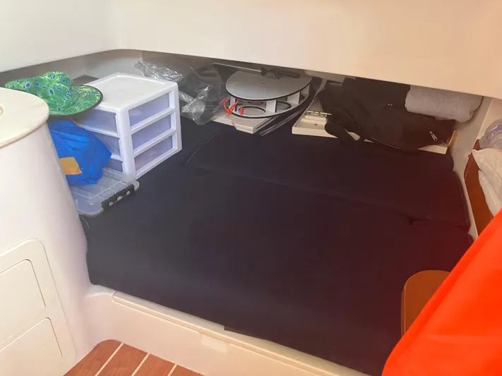  Yacht Photos Pics 2020 Grady-White Canyon 336 cabin storage area with organized compartments and supplies.