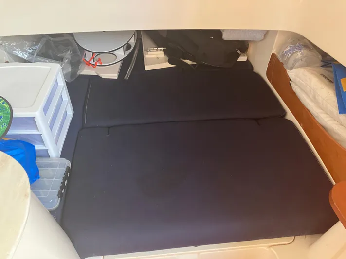  Yacht Photos Pics 2020 Grady-White Canyon 336 cabin interior with storage and bedding.