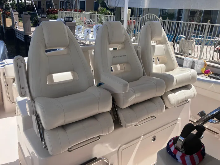  Yacht Photos Pics 2020 Grady-White Canyon 336 boat seats, luxurious white leather design.
