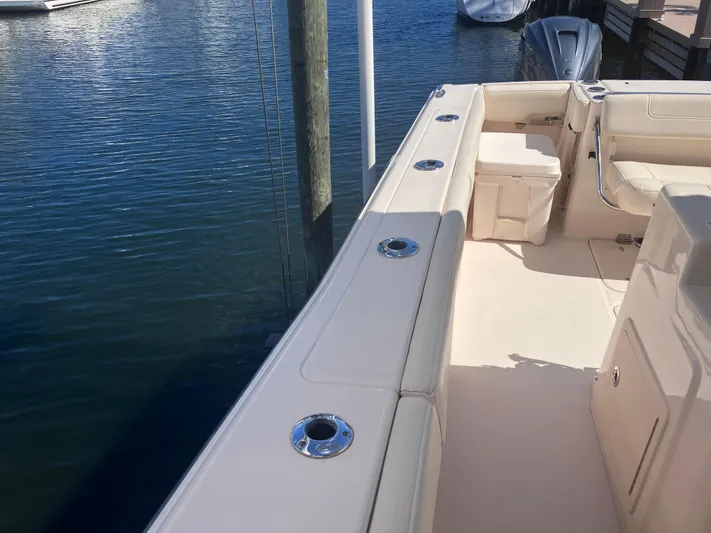 Yacht Photos Pics 2020 Grady-White Canyon 336 boat docked, showcasing spacious deck and seating area.