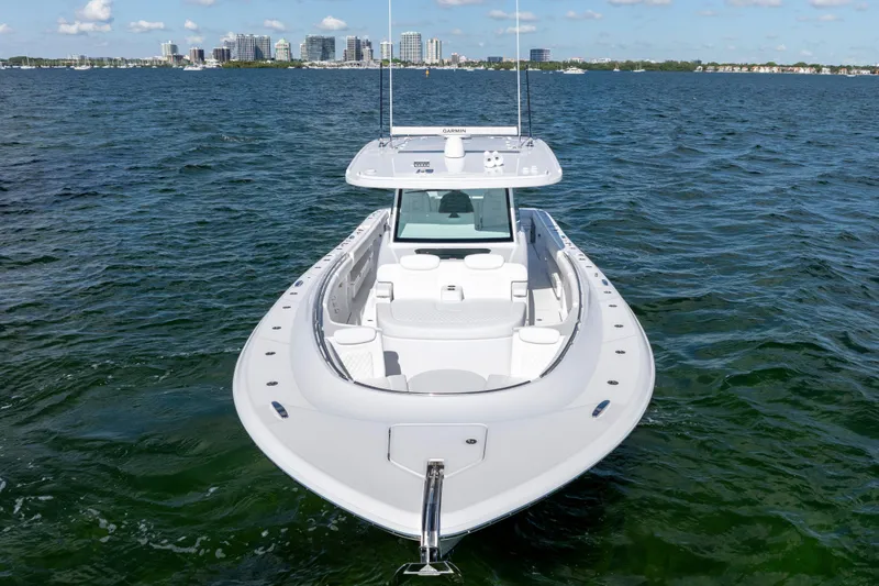  Yacht Photos Pics 2026 HCB 48 Campeon boat on water with city skyline in background.