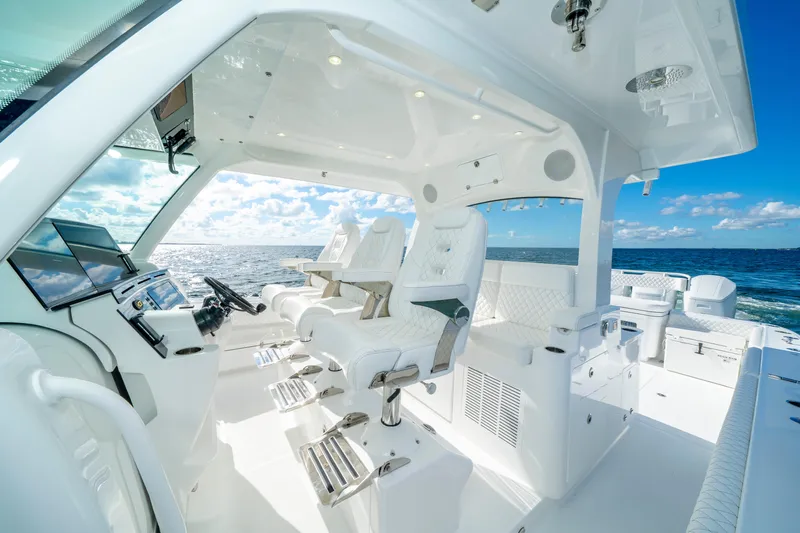  Yacht Photos Pics Luxurious interior of 2026 HCB 48 Campeon boat with ocean view and modern controls.