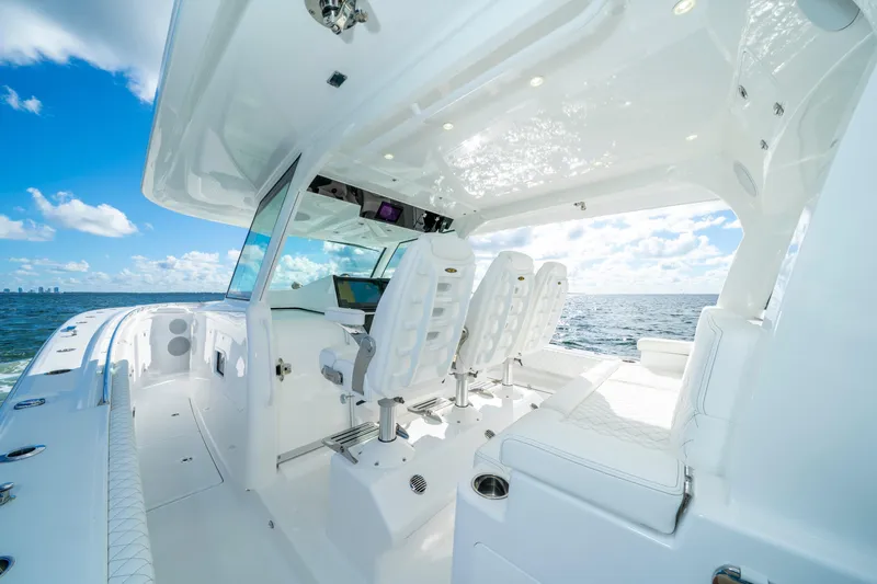  Yacht Photos Pics Luxurious 2026 HCB 48 Campeon boat interior with ocean view and modern seating.