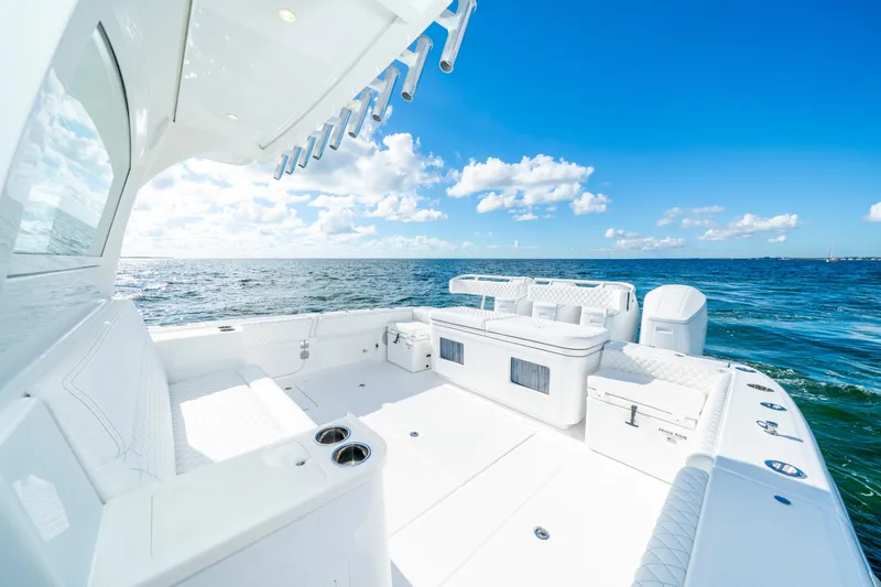  Yacht Photos Pics Luxurious 2026 HCB 48 Campeon boat on open sea under clear blue sky.
