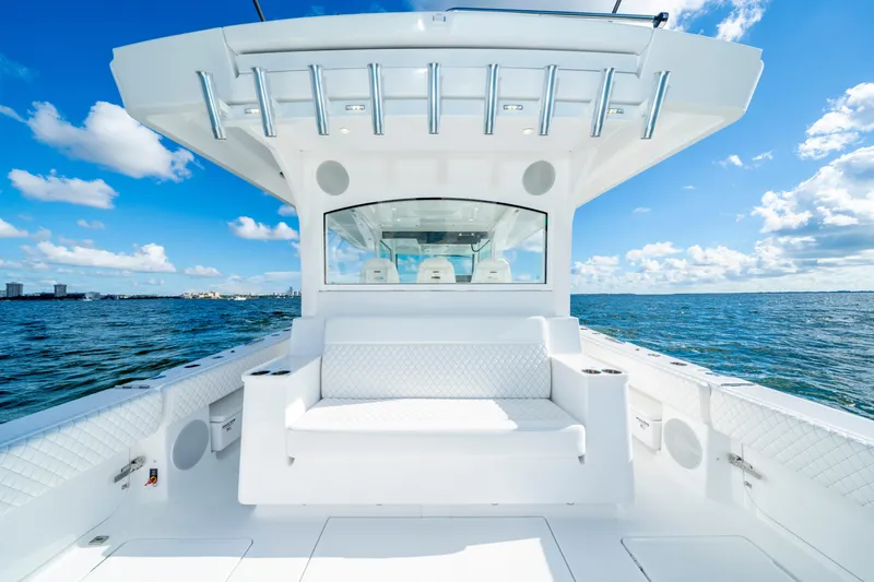  Yacht Photos Pics 2026 HCB 48 Campeon boat interior with white seating, ocean view, and blue sky.