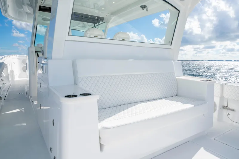  Yacht Photos Pics Luxurious seating on the 2026 HCB 48 Campeon boat, with ocean view and blue sky.