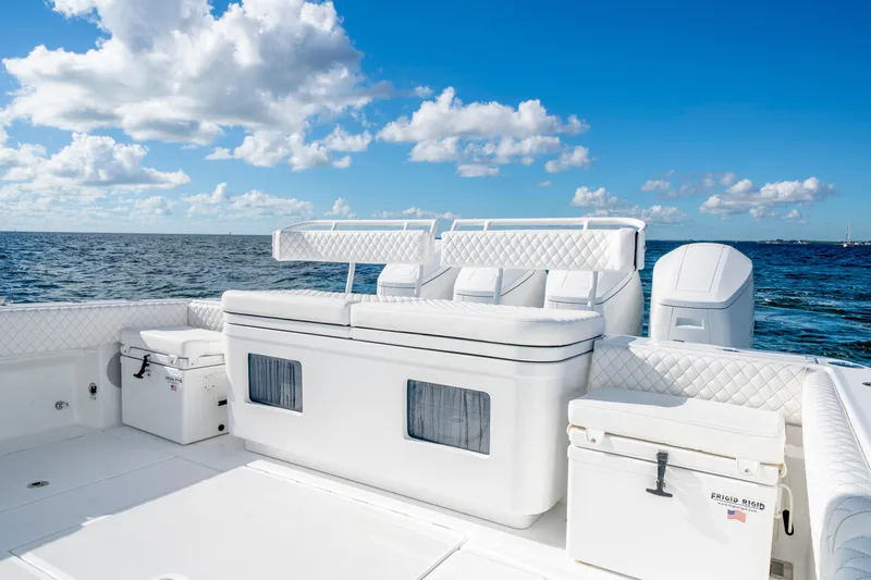  Yacht Photos Pics Luxury seating on 2026 HCB 48 Campeon boat with ocean view and blue sky.