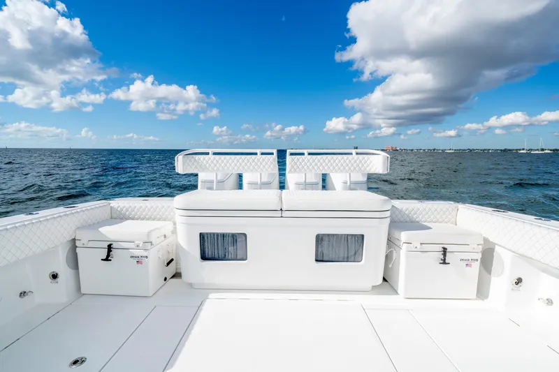  Yacht Photos Pics HCB 48 Campeon 2026 boat deck with seating, ocean view, and blue sky.