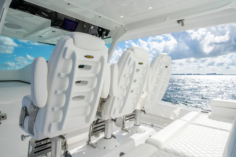  Yacht Photos Pics Luxury seating on 2026 HCB 48 Campeon boat with ocean view.