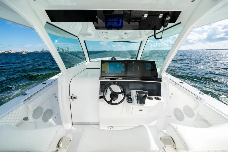  Yacht Photos Pics Interior view of 2026 HCB 48 Campeon boat cockpit with ocean backdrop.