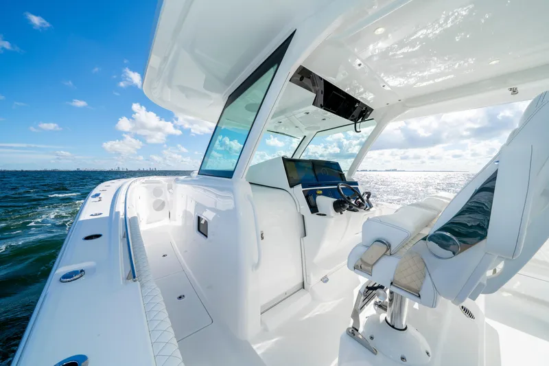  Yacht Photos Pics 2026 HCB 48 Campeon boat interior with ocean view, featuring modern helm and seating.