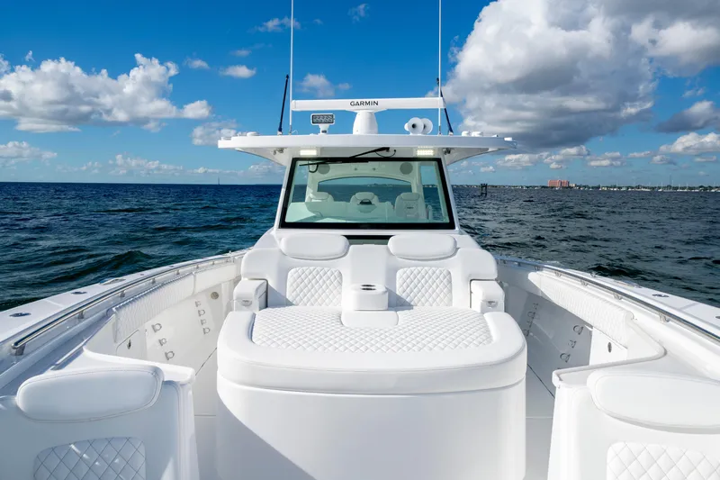  Yacht Photos Pics Luxurious 2026 HCB 48 Campeon boat on open sea under blue sky.