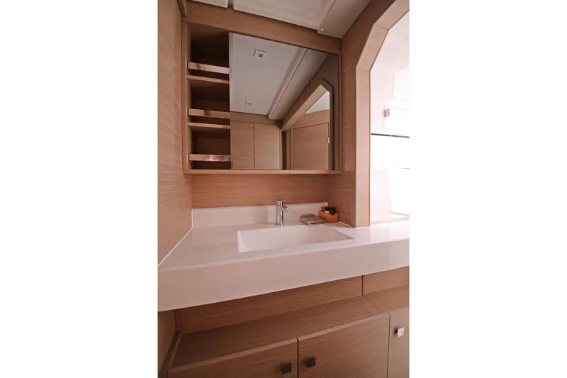  Yacht Photos Pics Modern bathroom interior of 2025 Lagoon 43 yacht with sleek wooden cabinetry.