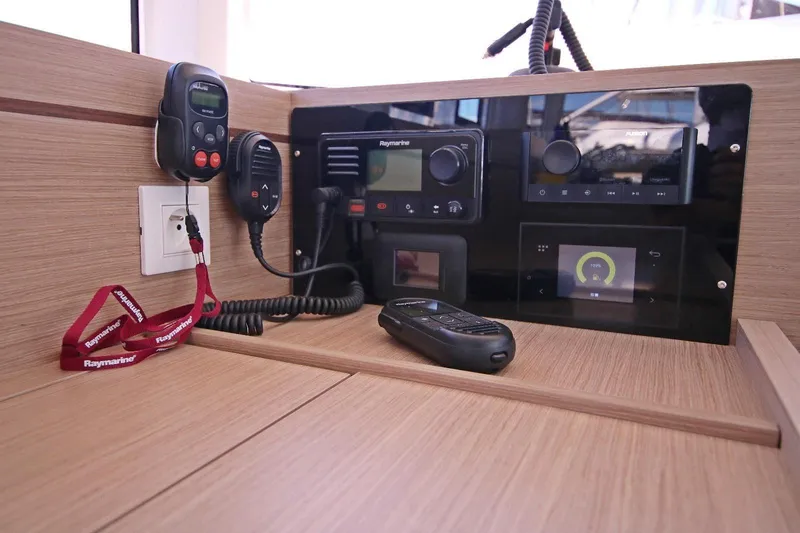  Yacht Photos Pics Control panel of 2025 Lagoon 43 yacht with Raymarine equipment and communication devices.