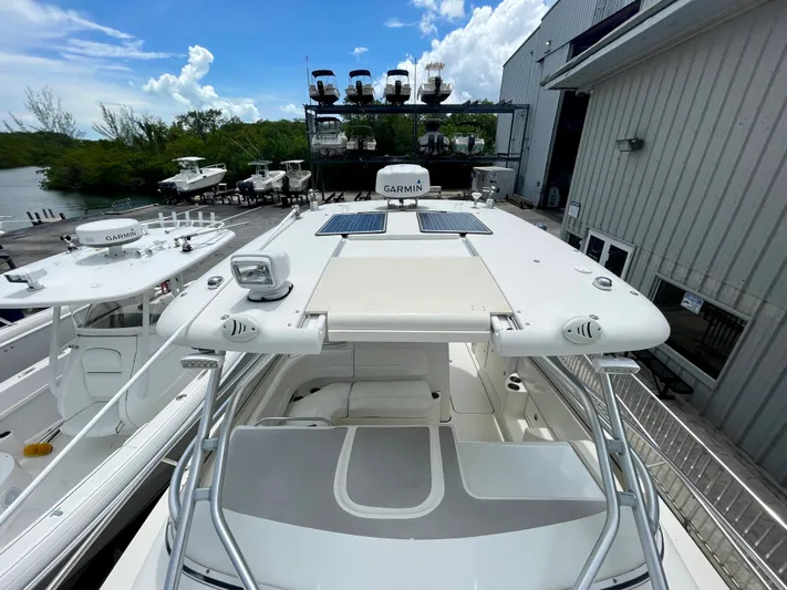  Yacht Photos Pics 2005 Hydra-Sports Vector 3300 VX boat docked near marina, clear sky background.