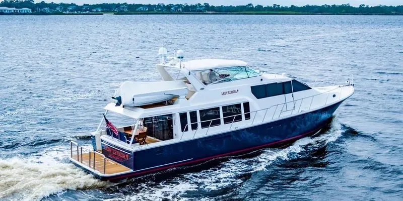  Yacht Photos Pics 2000 Pacific Mariner 65 Motoryacht cruising on open water.