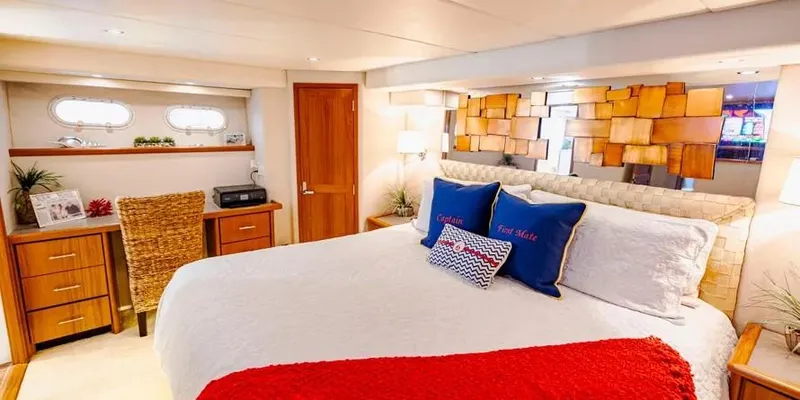  Yacht Photos Pics Luxurious bedroom in 2000 Pacific Mariner 65 Motoryacht with modern decor and cozy bedding.