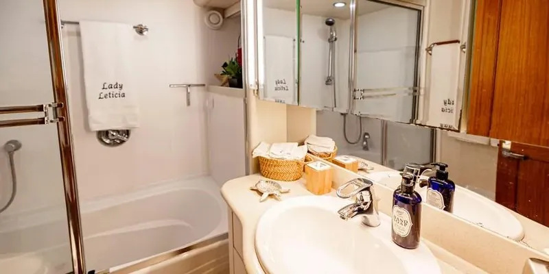  Yacht Photos Pics Luxurious bathroom in 2000 Pacific Mariner 65 Motoryacht with elegant fixtures and decor.