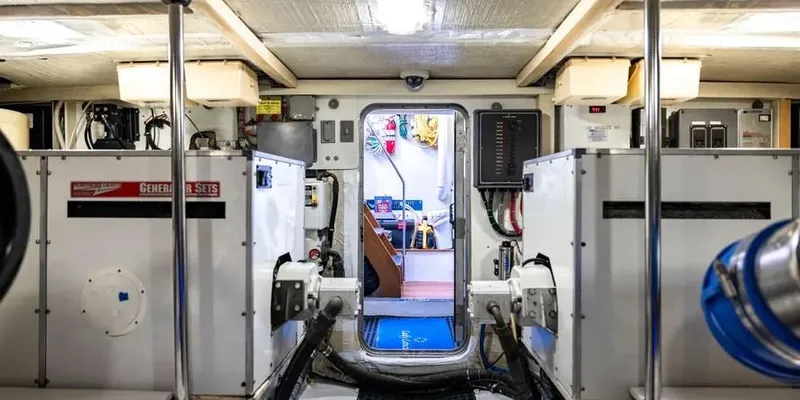  Yacht Photos Pics Engine room of 2000 Pacific Mariner 65 Motoryacht, showcasing equipment and control panels.