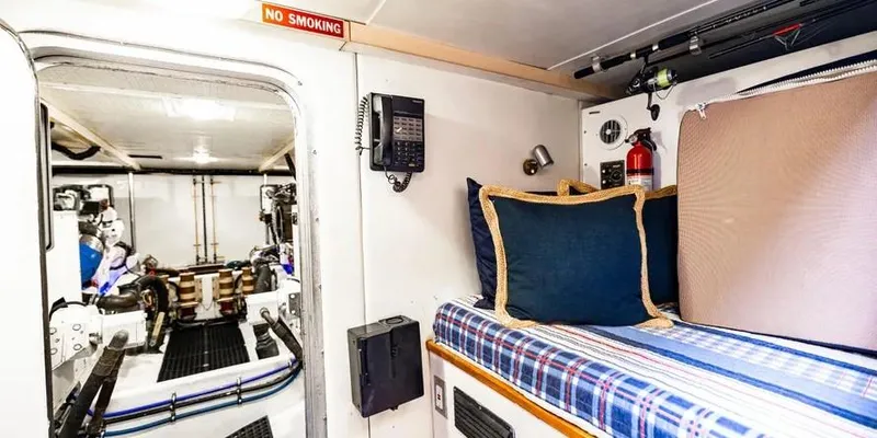  Yacht Photos Pics Interior of 2000 Pacific Mariner 65 Motoryacht with cozy cabin and engine room view.