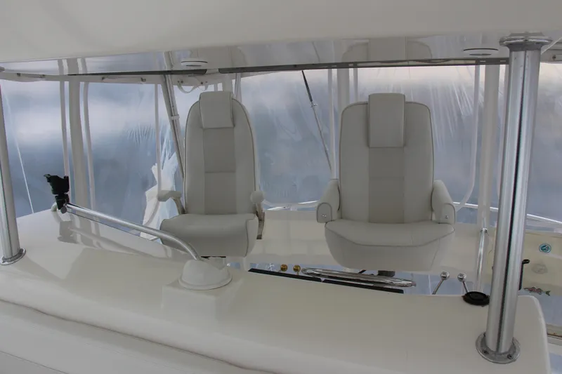 Galatea Yacht Photos Pics Luxury helm seats on a 2000 Post 50 yacht, featuring sleek white design.