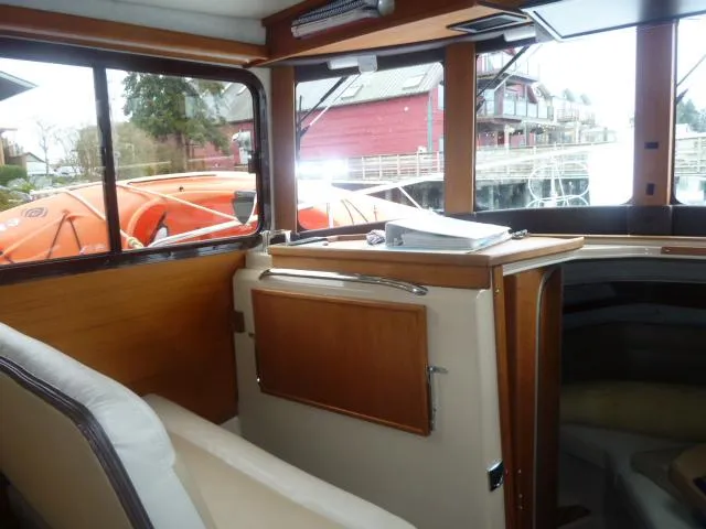 Island Wanderer Yacht Photos Pics Interior of 2013 Ranger Tugs R-31 boat with wooden cabinetry and seating.