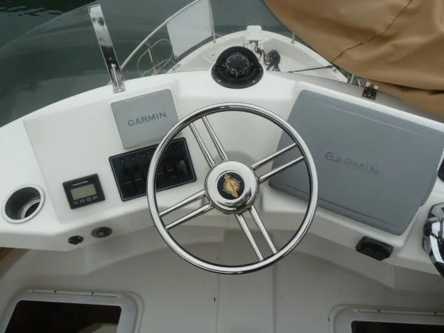 Island Wanderer Yacht Photos Pics Steering wheel and Garmin navigation on 2013 Ranger Tugs R-31 boat dashboard.