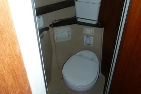 Island Wanderer Yacht Photos Pics 2013 Ranger Tugs R-31 boat bathroom interior with toilet and storage.