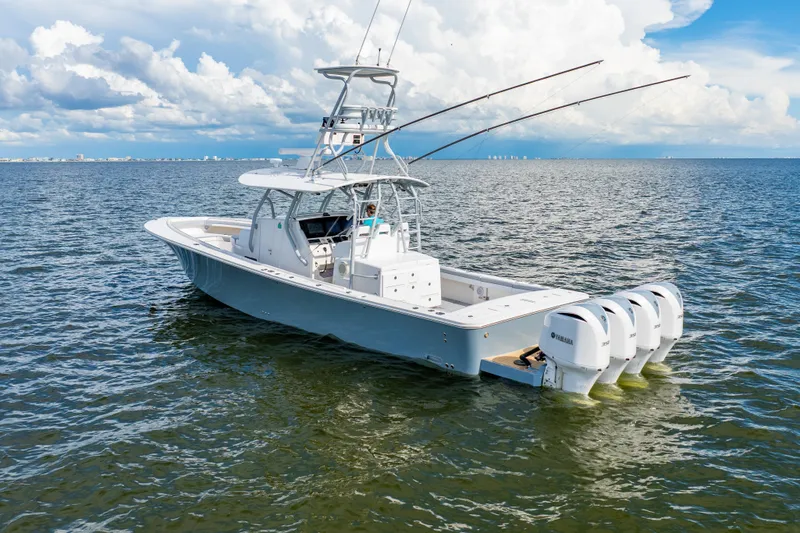  Yacht Photos Pics 2018 Regulator 41 boat with four Yamaha engines on open water under cloudy sky.