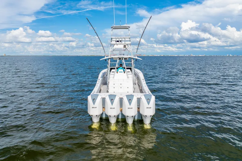  Yacht Photos Pics 2018 Regulator 41 boat with four powerful engines on open water under a blue sky.